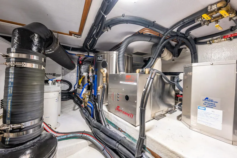 Sherlock Holmes Yacht Photos Pics Engine room of 2016 Kadey-Krogen 44E yacht with complex piping and machinery.