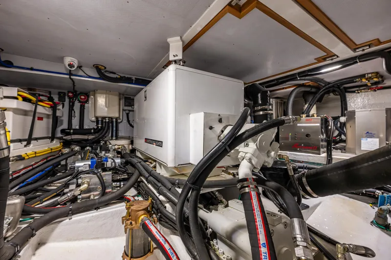 Sherlock Holmes Yacht Photos Pics Engine room of 2016 Kadey-Krogen 44E yacht with complex machinery and wiring.