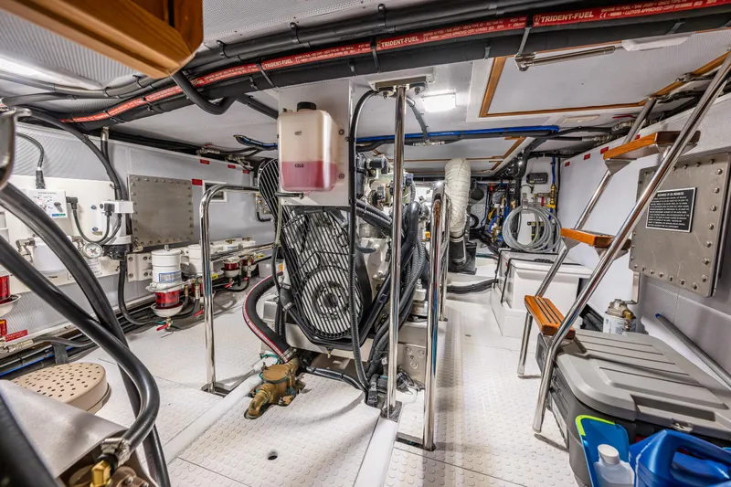 Sherlock Holmes Yacht Photos Pics Engine room of 2016 Kadey-Krogen 44E yacht, featuring complex machinery and organized layout.