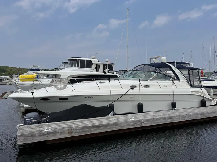  Yacht Photos Pics 2001 Sea Ray 410 Express Cruiser docked at marina under clear sky.