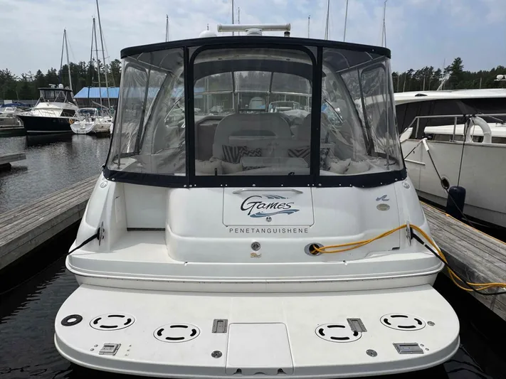  Yacht Photos Pics 2001 Sea Ray 410 Express Cruiser docked at marina, rear view with clear canopy.