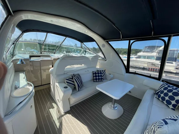  Yacht Photos Pics Luxurious interior of 2001 Sea Ray 410 Express Cruiser with seating and table.