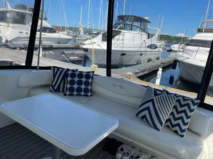  Yacht Photos Pics 2001 Sea Ray 410 Express Cruiser interior with patterned cushions, docked at marina.