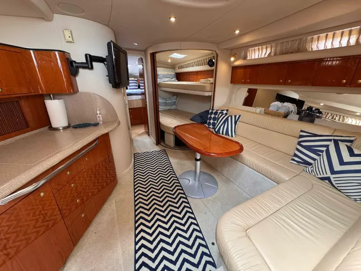 Yacht Photos Pics Luxurious interior of 2001 Sea Ray 410 Express Cruiser with elegant seating and modern amenities.