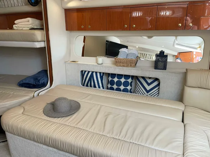  Yacht Photos Pics Interior of 2001 Sea Ray 410 Express Cruiser with beige seating and decorative pillows.
