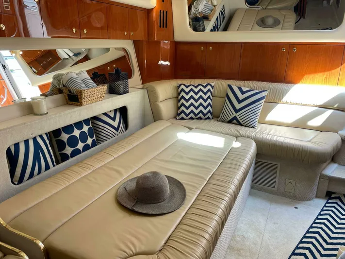  Yacht Photos Pics Luxurious interior of 2001 Sea Ray 410 Express Cruiser with stylish seating and decorative pillows.