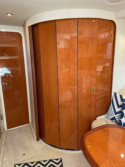  Yacht Photos Pics 2001 Sea Ray 410 Express Cruiser interior with polished wood cabinetry and modern decor.