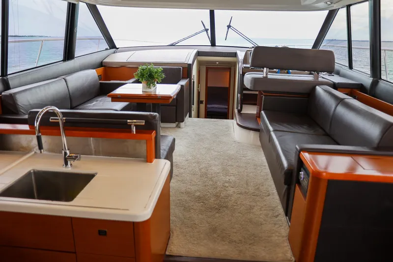  Yacht Photos Pics Luxurious interior of a 2015 Prestige 520 yacht with modern furnishings and ocean view.