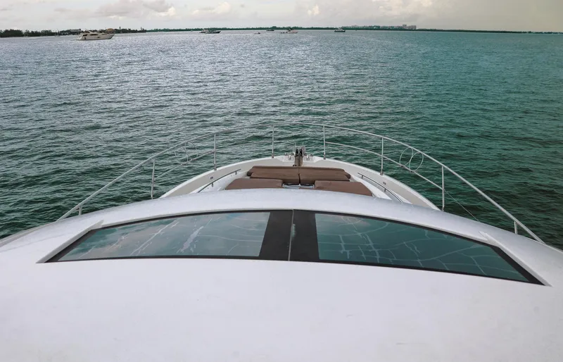  Yacht Photos Pics Prestige 520 yacht cruising on open water, 2015 model, with clear sky and calm sea.