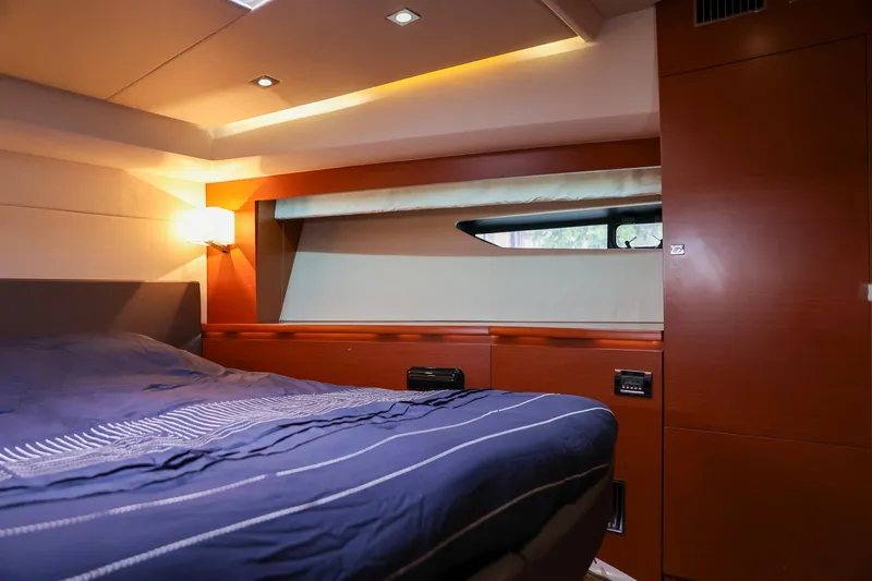  Yacht Photos Pics Luxurious cabin interior of a 2015 Prestige 520 yacht with modern wood finishes.