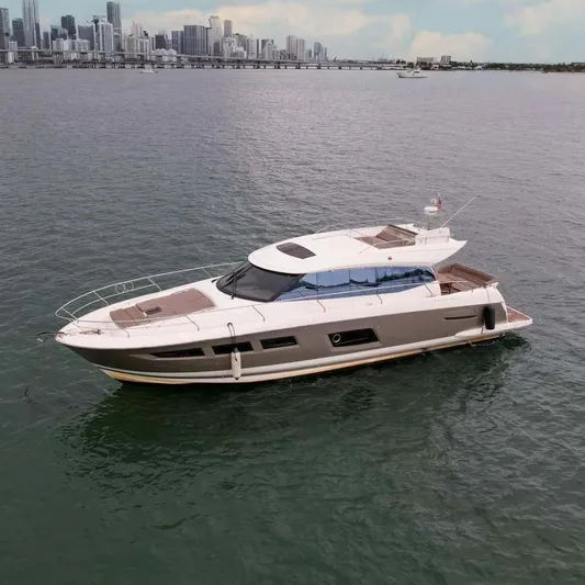  Yacht Photos Pics Luxury 2015 Prestige 520 yacht cruising near city skyline.