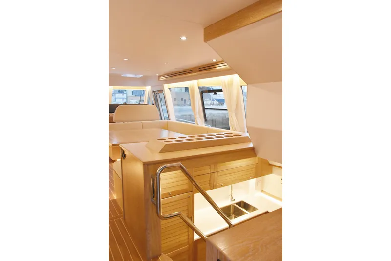  Yacht Photos Pics Luxurious interior of 2026 Sasga Yachts Menorquin 68 with elegant wood finishes.