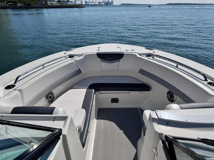  Yacht Photos Pics 2021 Robalo R317 Dual Console boat with spacious seating on calm water.