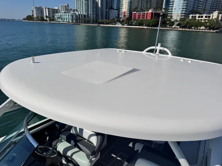  Yacht Photos Pics 2021 Robalo R317 Dual Console boat with city skyline in background.