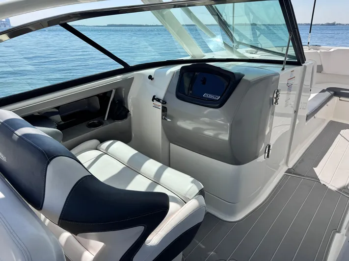  Yacht Photos Pics 2021 Robalo R317 Dual Console boat interior with helm, seating, and ocean view.