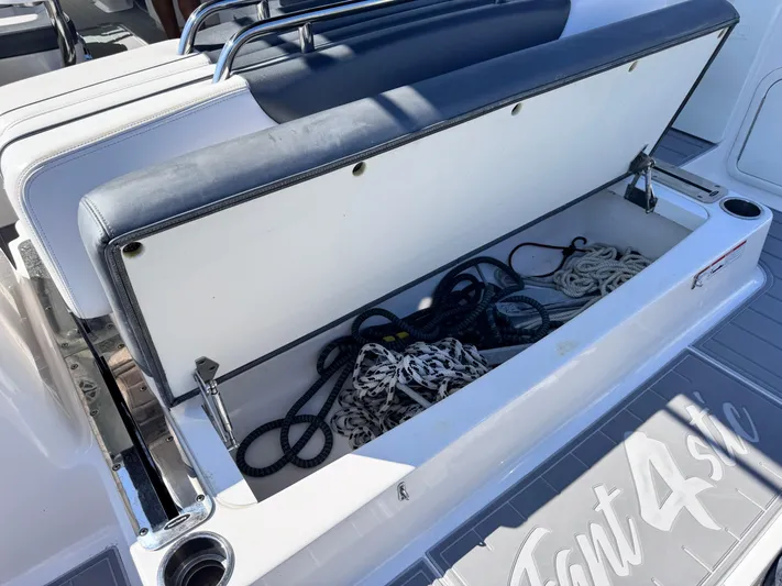  Yacht Photos Pics 2021 Robalo R317 Dual Console boat storage compartment with ropes inside.
