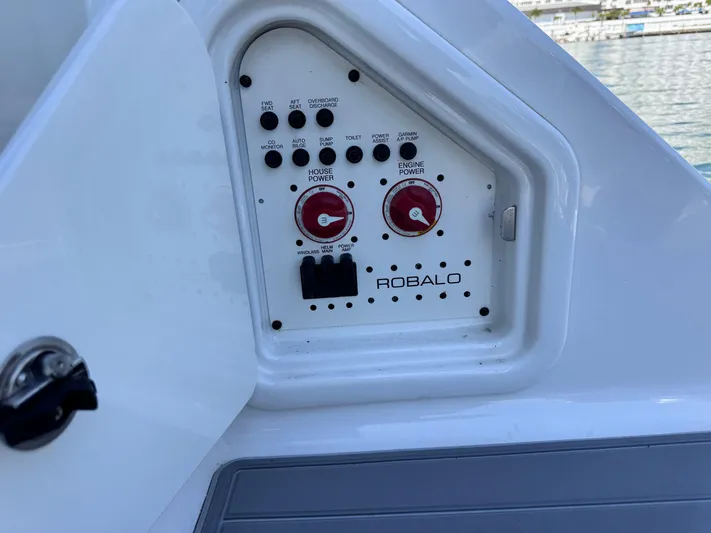  Yacht Photos Pics Control panel of 2021 Robalo R317 Dual Console boat with switches and dials.