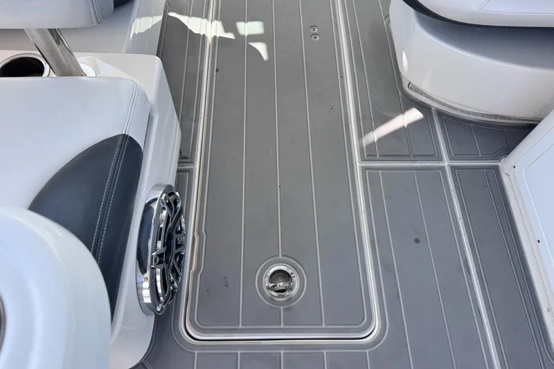  Yacht Photos Pics 2021 Robalo R317 Dual Console boat deck with gray flooring and seating.