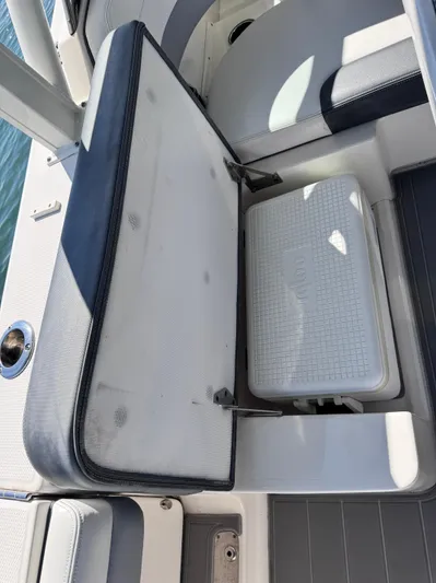  Yacht Photos Pics 2021 Robalo R317 Dual Console boat seat with storage compartment and cooler.