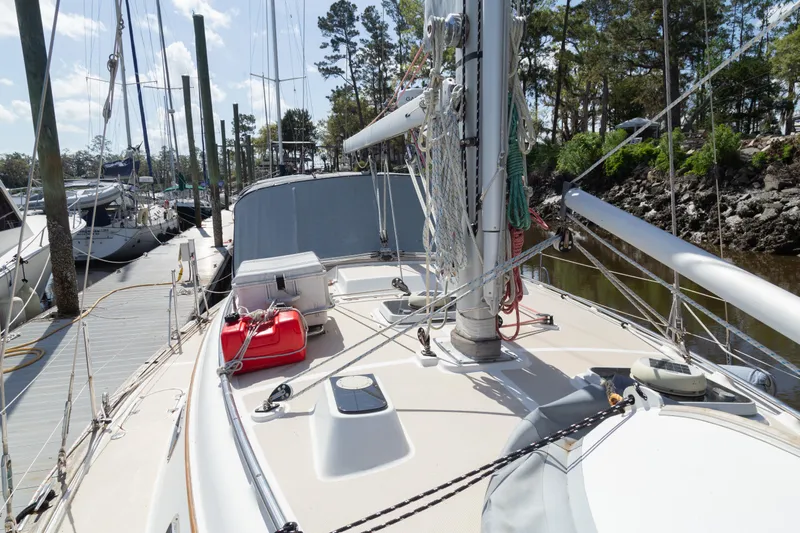 Harvest Moon Yacht Photos Pics 1999 Island Packet 380 sailboat docked, showcasing deck and rigging under clear skies.