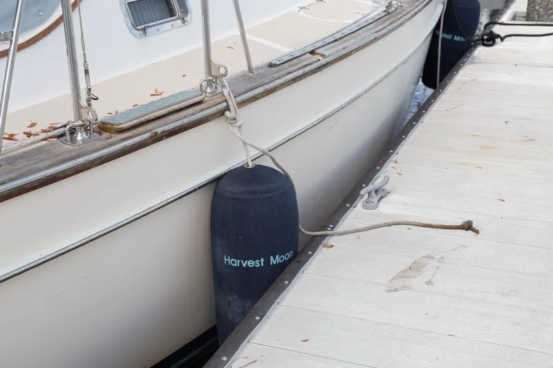 Harvest Moon Yacht Photos Pics Island Packet 380 sailboat docked with fenders, 1999 model.