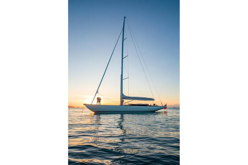 Gwenhyfar II Yacht Photos Pics Sailing yacht Spirit C72, 2023 model, at sunset on calm waters.