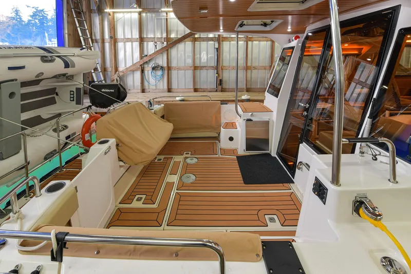 Celtic Mist Yacht Photos Pics 2023 Ranger Tugs R-29S boat interior with wood flooring and modern amenities.