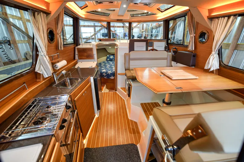 Celtic Mist Yacht Photos Pics 2023 Ranger Tugs R-29S interior with modern kitchen and dining area.