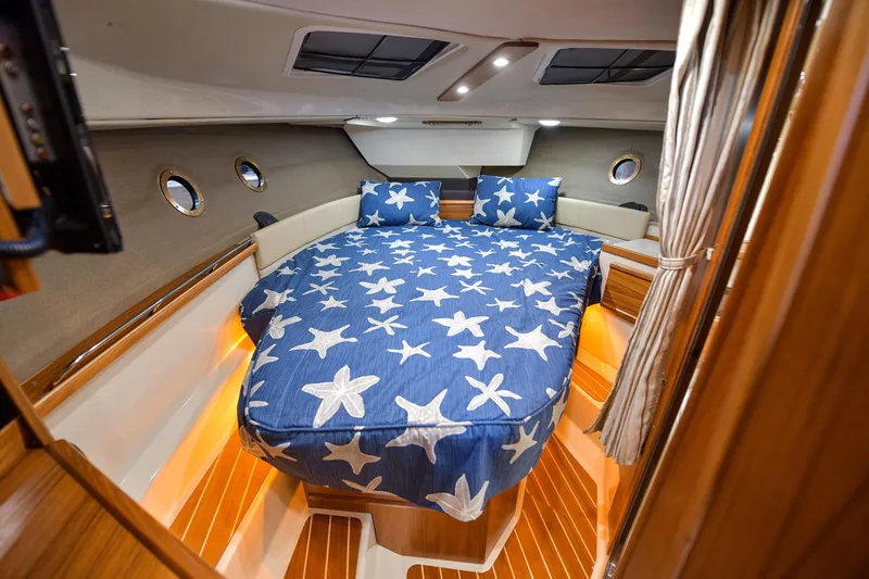 Celtic Mist Yacht Photos Pics Cozy cabin interior of 2023 Ranger Tugs R-29S with starfish bedding.