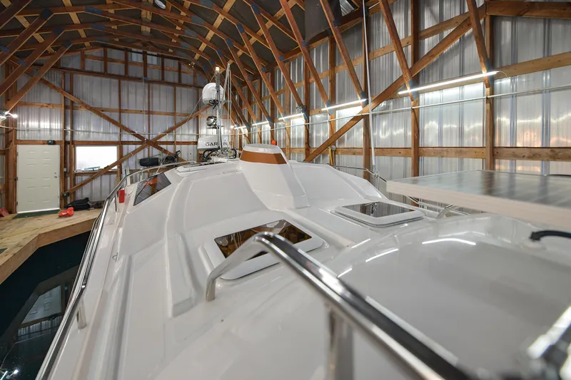 Celtic Mist Yacht Photos Pics 2023 Ranger Tugs R-29S boat docked in a wooden boathouse interior.
