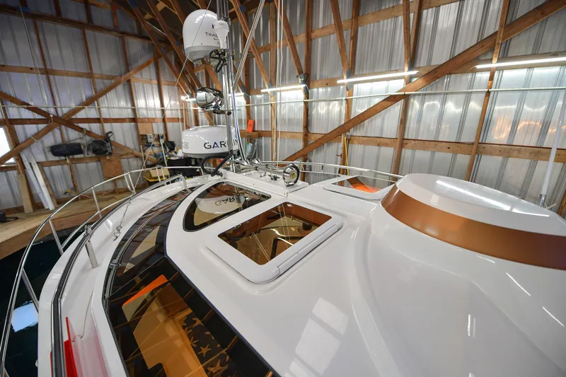 Celtic Mist Yacht Photos Pics 2023 Ranger Tugs R-29S boat in a wooden boathouse, featuring advanced navigation equipment.