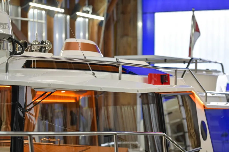 Celtic Mist Yacht Photos Pics 2023 Ranger Tugs R-29S boat in a showroom, showcasing sleek design and modern features.