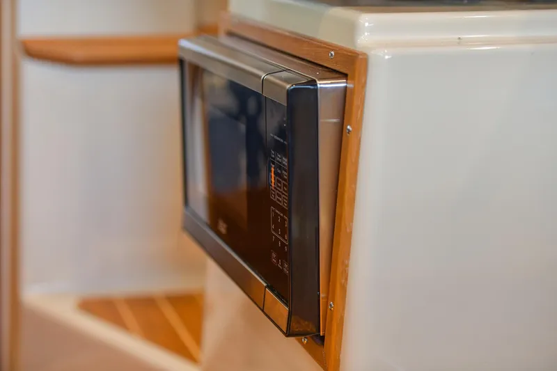 Celtic Mist Yacht Photos Pics Microwave in 2023 Ranger Tugs R-29S boat interior, featuring sleek design.