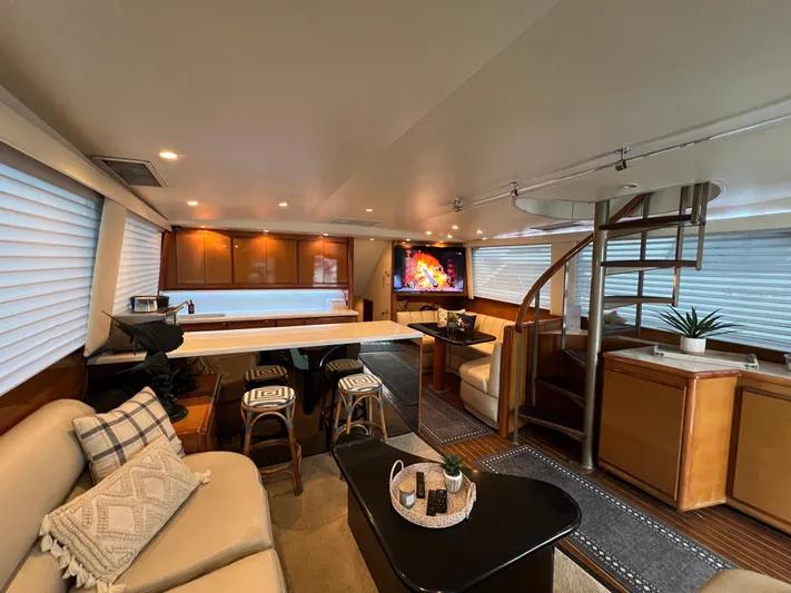 Todo Bien Yacht Photos Pics Luxurious interior of 2000 Viking 58 Enclosed Bridge yacht with modern furnishings and elegant design.