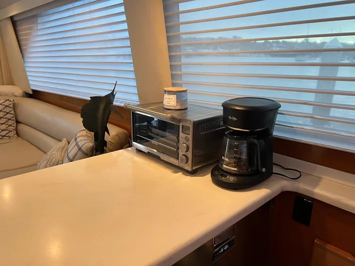 Todo Bien Yacht Photos Pics Kitchen area on a 2000 Viking 58 Enclosed Bridge yacht with coffee maker and toaster oven.