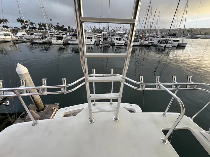 Todo Bien Yacht Photos Pics View from Viking 58 Enclosed Bridge yacht, overlooking marina with numerous docked boats.