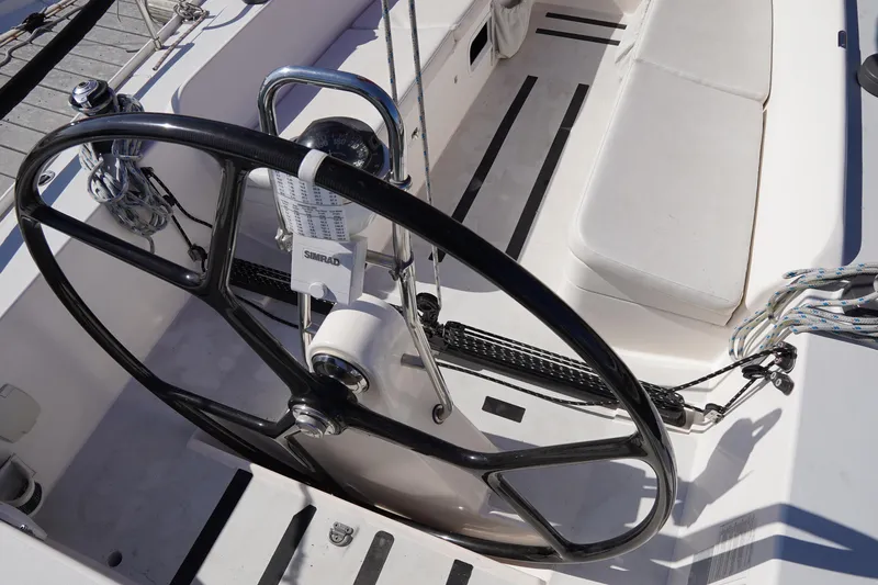  Yacht Photos Pics 2007 J Boats J/124 sailboat cockpit with steering wheel and seating.