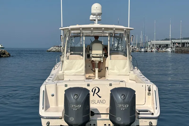 R & R Yacht Photos Pics 2008 Grady White Express boat with twin 350 V8 engines docked in a marina.