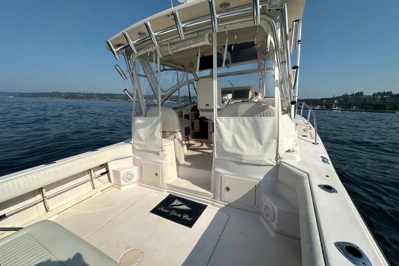 R & R Yacht Photos Pics 2008 Grady White Express boat on calm water, featuring spacious deck and seating.