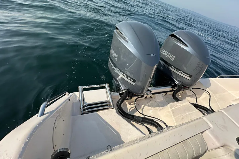 R & R Yacht Photos Pics 2008 Grady White Express boat with twin Yamaha V8 outboard engines on open water.