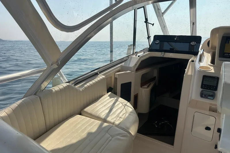 R & R Yacht Photos Pics 2008 Grady White Express boat interior with seating, dashboard, and ocean view.