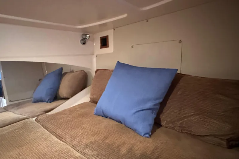 R & R Yacht Photos Pics Interior cabin of 2008 Grady White Express boat with blue and brown cushions.