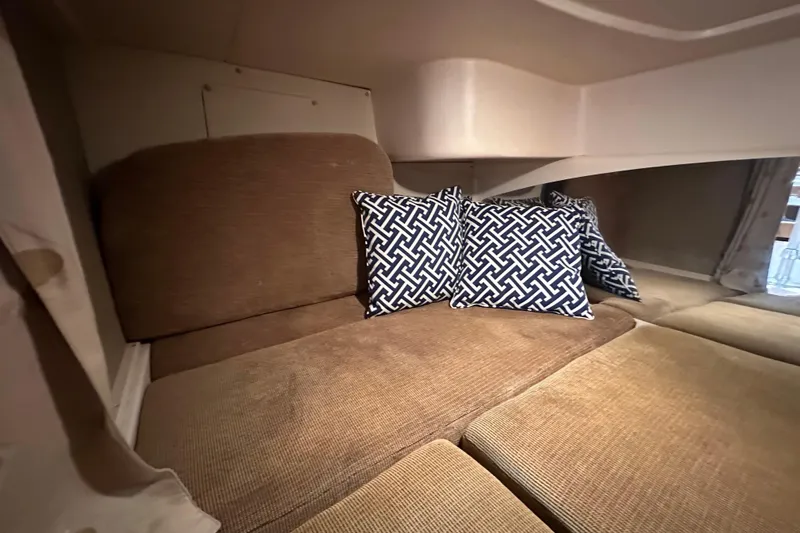 R & R Yacht Photos Pics 2008 Grady White Express cabin interior with patterned cushions on a beige seating area.