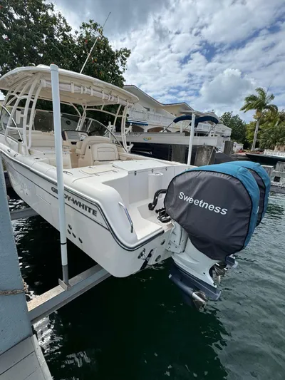 Sweetness Yacht Photos Pics 2021 Grady-White Freedom 285 boat docked, featuring covered outboard motor labeled "Sweetness."