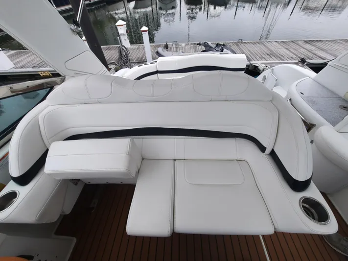 Paradox Yacht Photos Pics 2008 Formula 40 PC yacht with white leather seating and wooden deck.