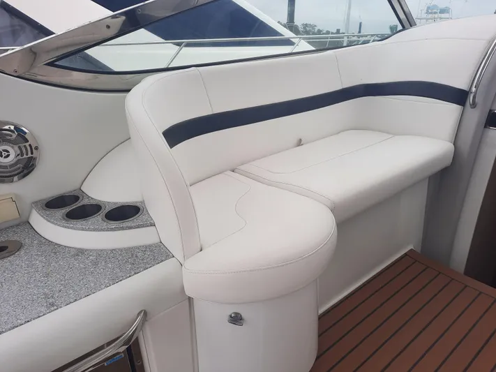 Paradox Yacht Photos Pics 2008 Formula 40 PC boat interior with white leather seating and cup holders.