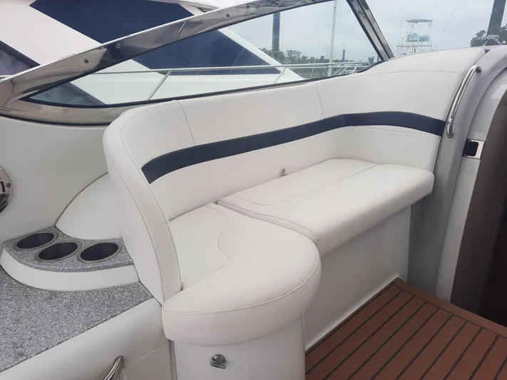 Paradox Yacht Photos Pics 2008 Formula 40 PC boat interior with white leather seating and cup holders.