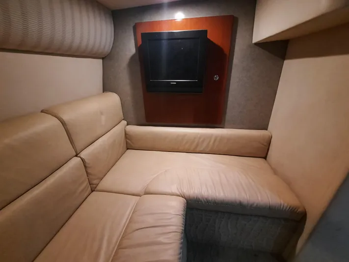 Paradox Yacht Photos Pics 2008 Formula 40 PC interior with beige leather seating and wall-mounted TV.