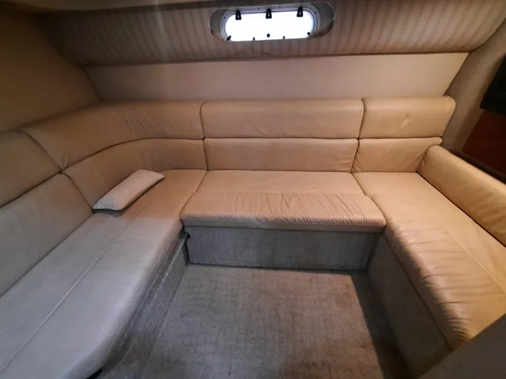 Paradox Yacht Photos Pics Interior seating area of a 2008 Formula 40 PC yacht with beige upholstery.