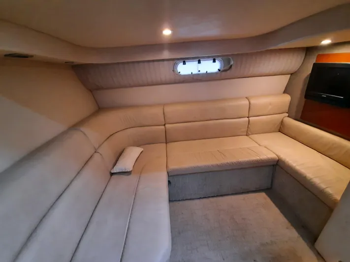 Paradox Yacht Photos Pics Interior of 2008 Formula 40 PC yacht with beige leather seating and small window.